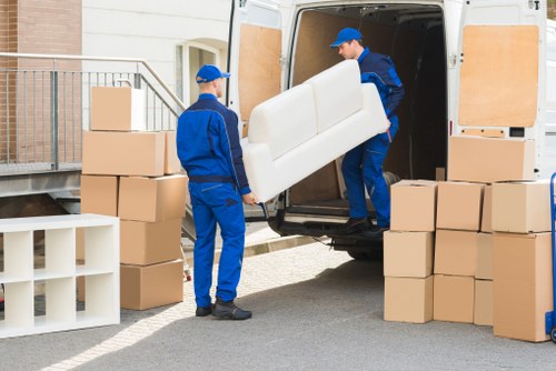 Local movers handling belongings in Queens Park