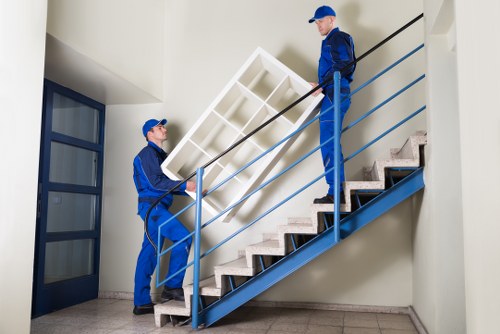Professional movers handling a house move in Queens Park