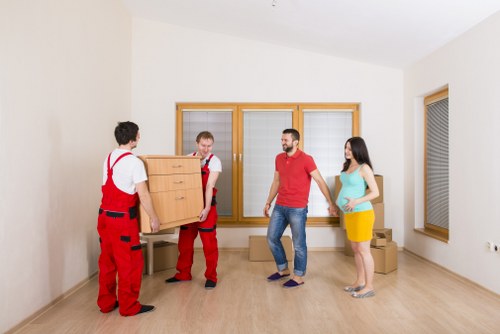Professional removal team loading furniture for a same day move in Queenspark