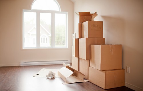 Removal team loading household furniture for a Queens Park relocation