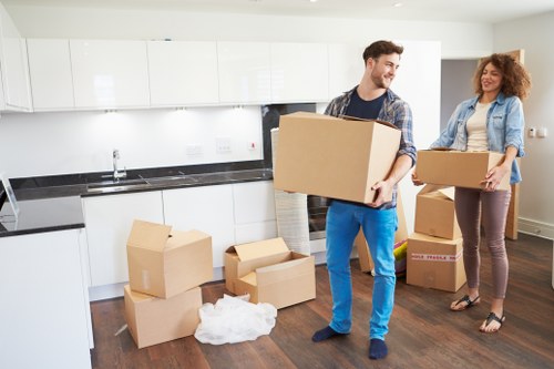 Careful wrapping of fragile items during a Queenspark move