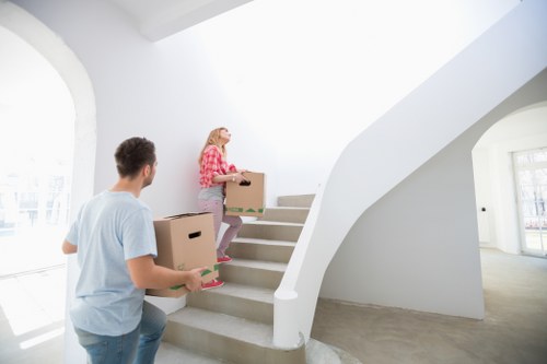 Worker checking and securing household goods before transport