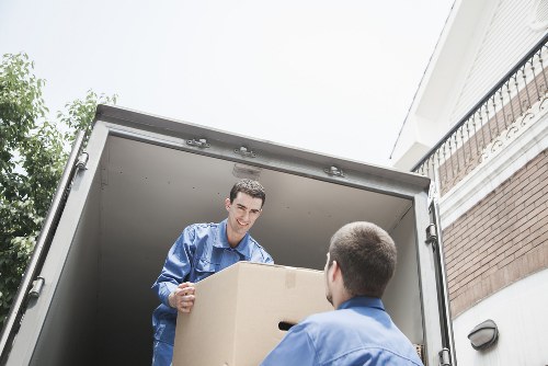 Staff trained to lift and carry items carefully during a Queens Park move