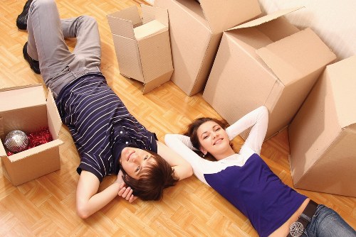Professional movers handling furniture with care