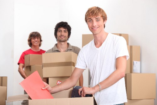 Local Queenspark movers handling residential furniture and boxes carefully