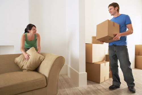 Professional team handling bulky furniture collection in Queenspark