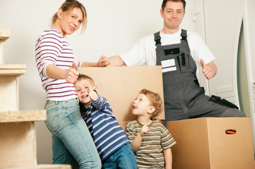 Local movers handling furniture during a Queenspark house move